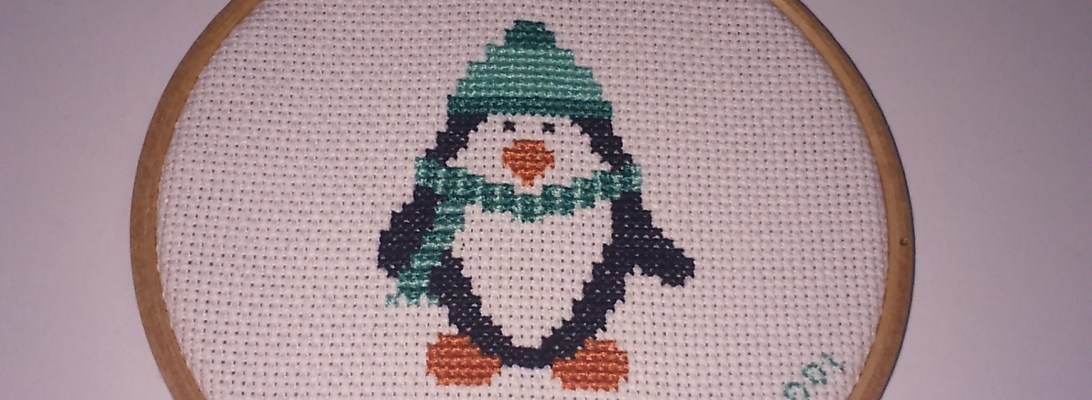 Adorno con pingüino en punto de cruz