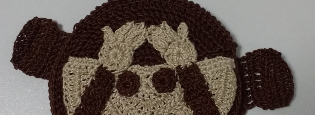 Monedero a ganchillo con monito de whatsapp